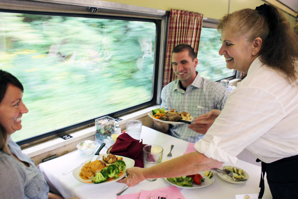 Guests enjoy a dinner train excursion