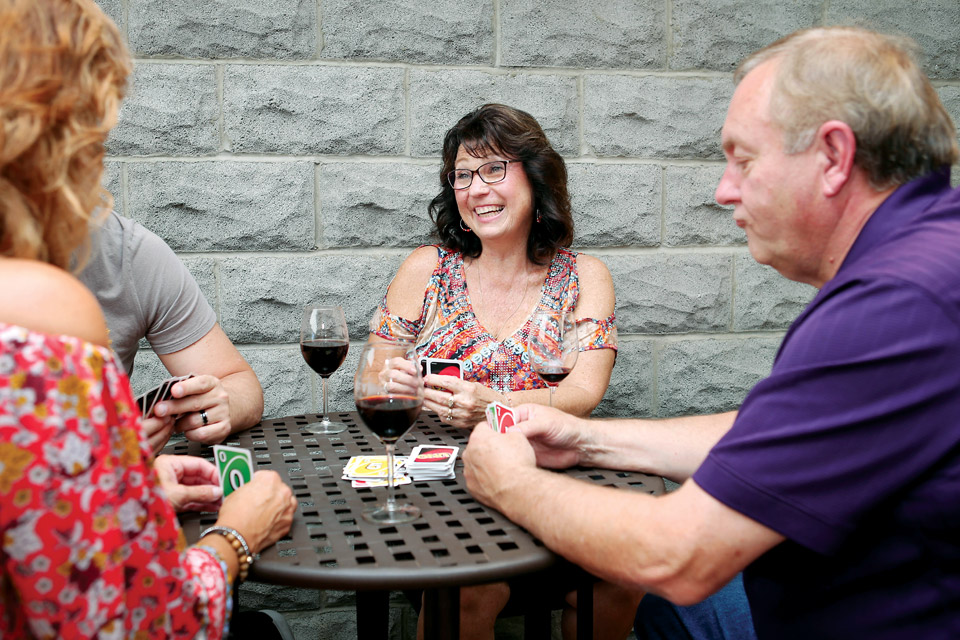 A group playing Uno at Firelands Winery 