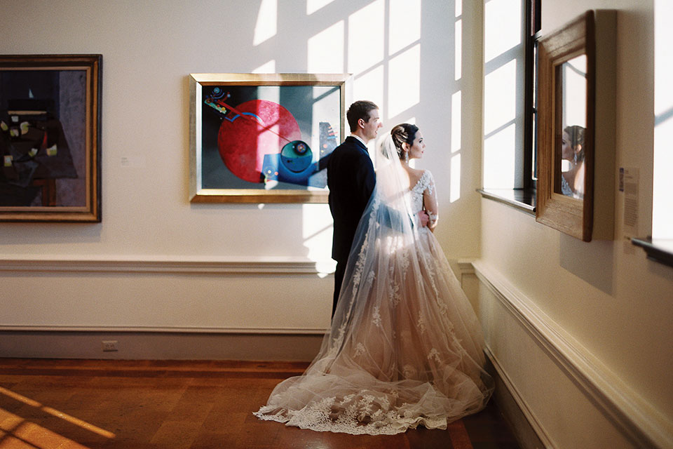 Wertz Wedding Dayton Art Institute Bride and Groom Amongst Exhibits (photo by Jenny Haas Photography)