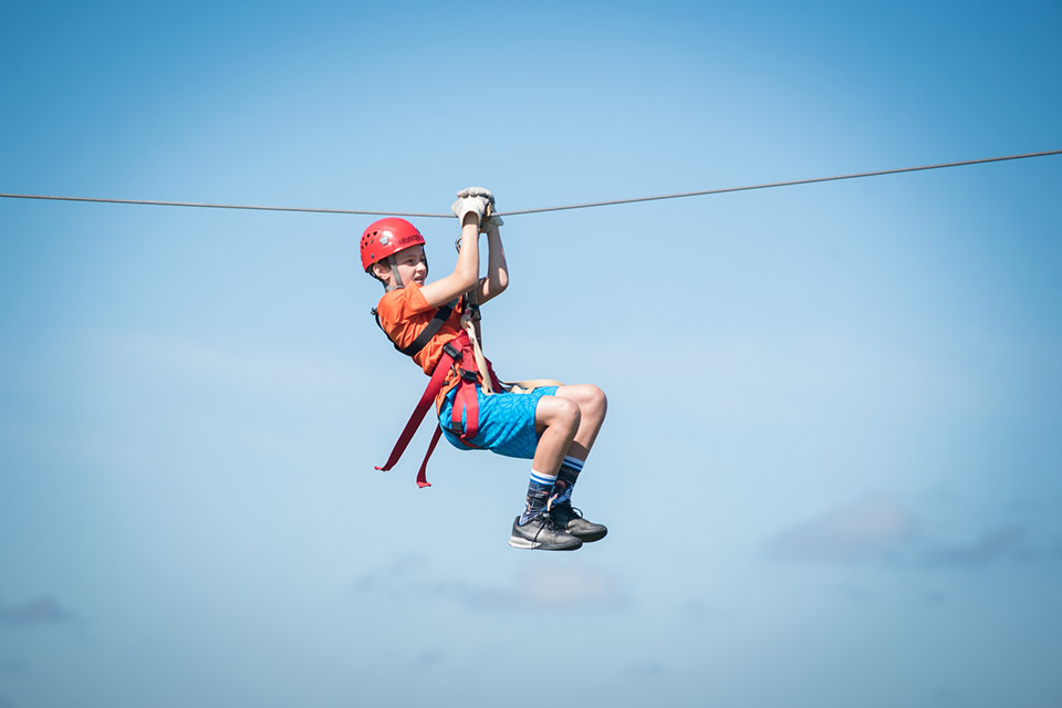 Child on zip line at The Wilds (photo by Grahm S. Jones, Columbus Zoo and Aquarium)