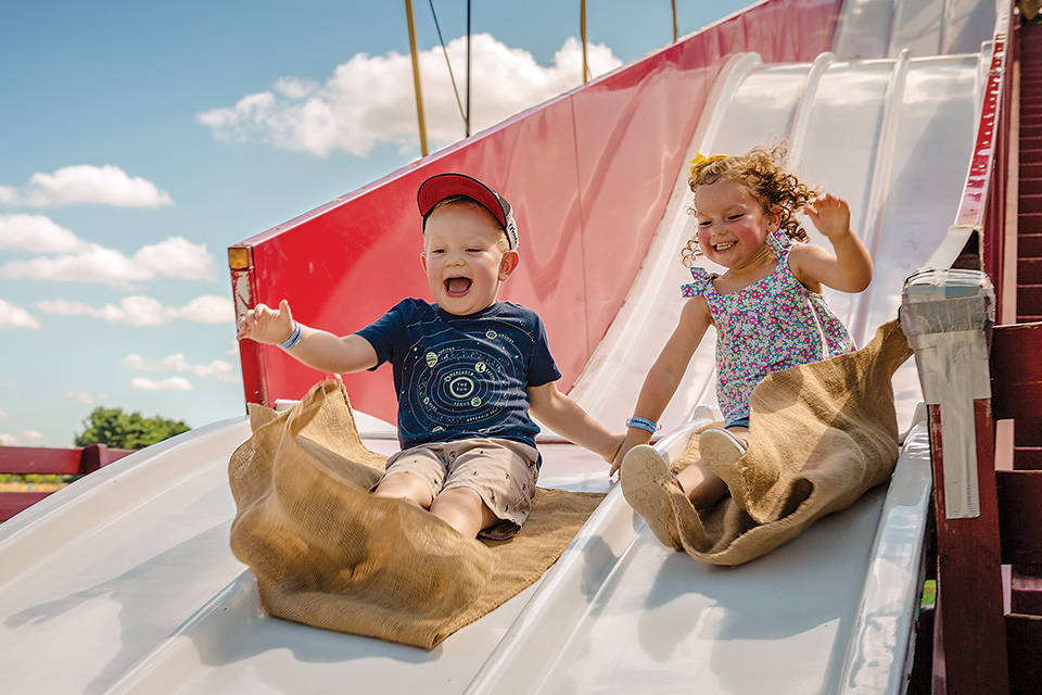 Kids sliding at Young's Jersey Dairy (photo courtesy of Young's Jersey Dairy)