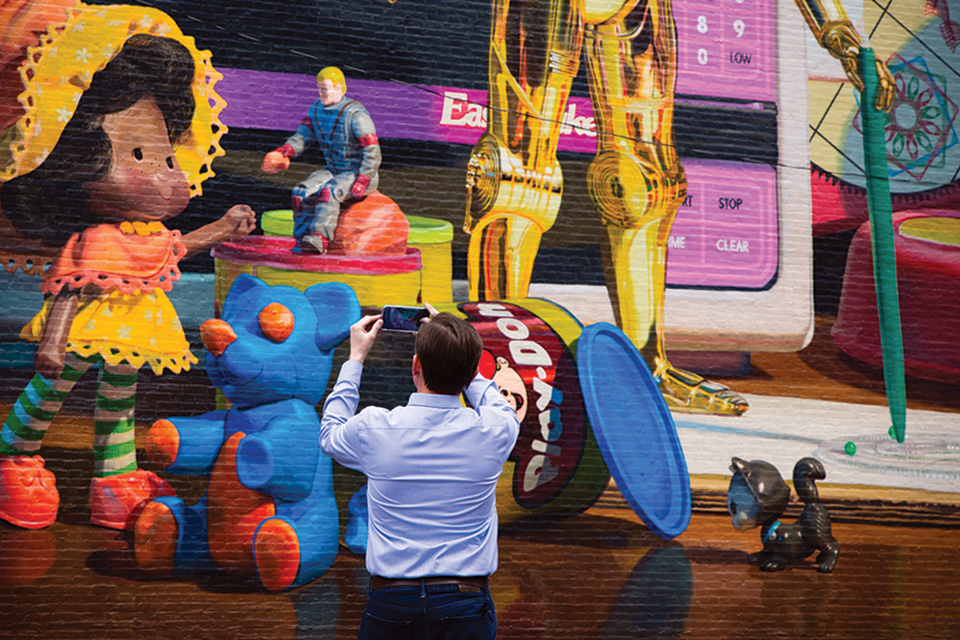 Editor Jim Vickers in front of Cincinnati's toy heritage mural (photo by Stephanie Park) Editor Jim Vickers in front of Cincinnati's toy heritage mural (photo by Stephanie Park)
