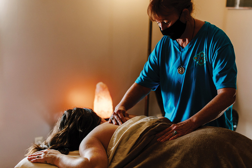 Woman getting a massage at Inner Wisdom Wellness (photo by Megan Leigh Barnard)