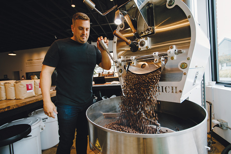 Man roasting beans at Rost Coffee