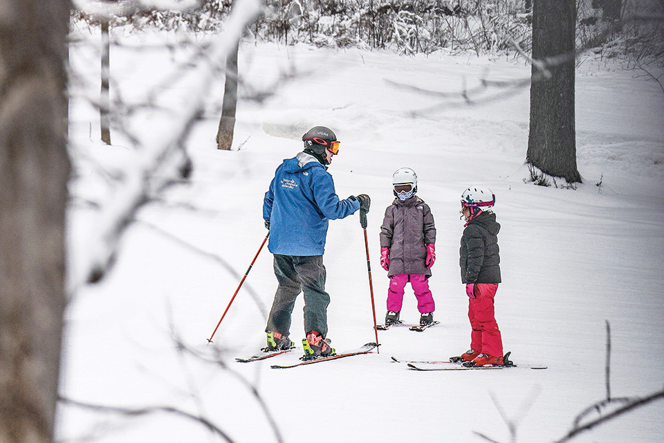 Person teaching kids how to ski at Alpine Valley (photo courtesy of Vail Ski Resorts)
