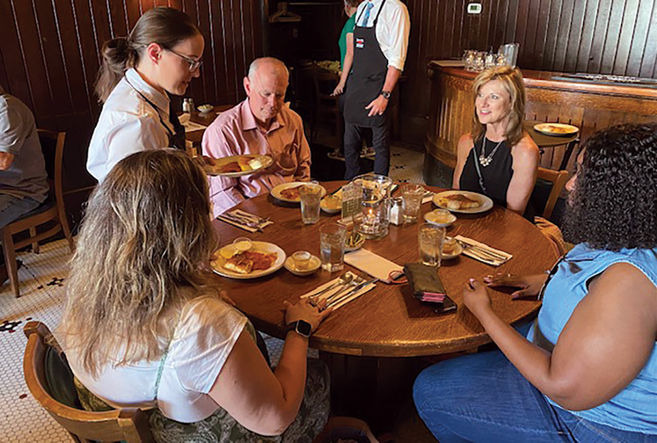 Group of people eating at a Canton Food Tours location (photo courtesy of Canton Food Tours)