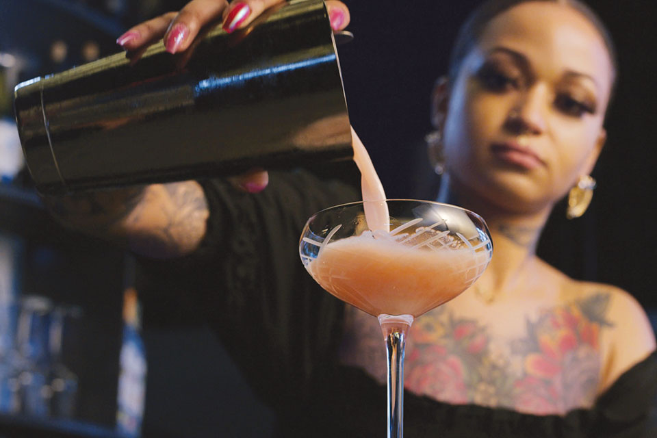 Woman pouring cocktail (photo courtesy of Libbey Glass)