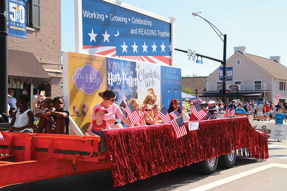 Adult and kids on a parade float during the Americana Festival (photo courtesy of the Americana Festival)
