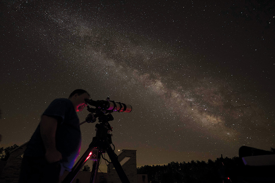 Man stargazing at John Glenn Astronomy Park (photo by Brad Hoehne)