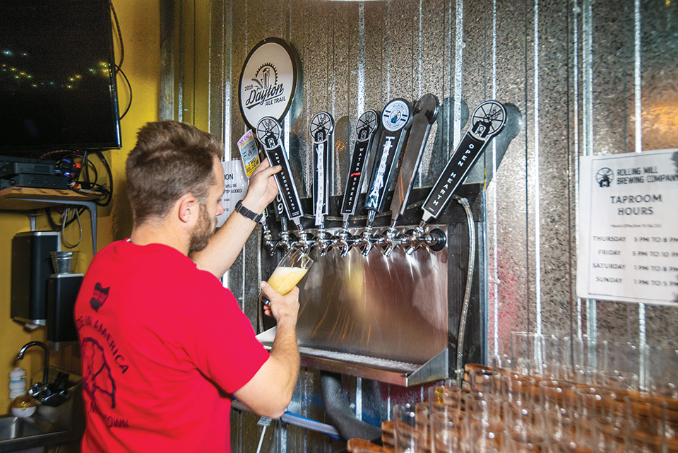 Man pouring beer at Rolling Mill Brewing Co. (photo courtesy of Travel Butler County)