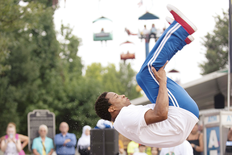 Performer doing a flip in the air (photo courtesy of Ohio State Fair)