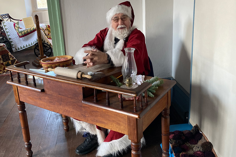 Santa Claus at his desk for Christmas in Zoar (photo courtesy of Christmas in Zoar)