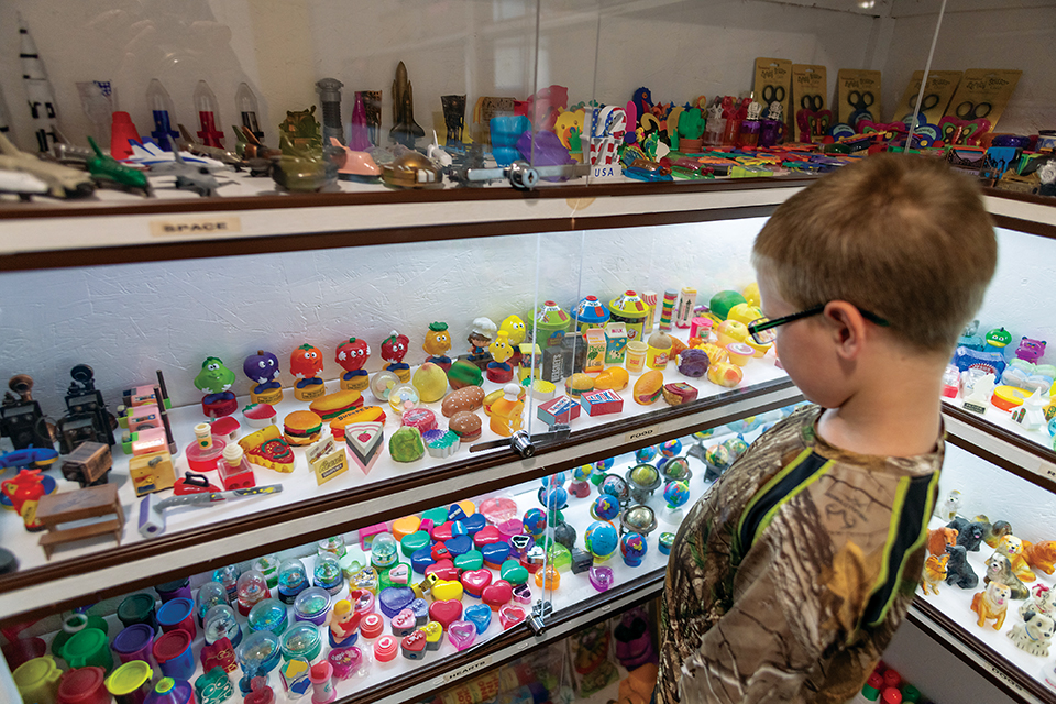 Boy looking at display at Paul A. Johnson Pencil Sharpener Museum in Logan (photo by Ohio Images)