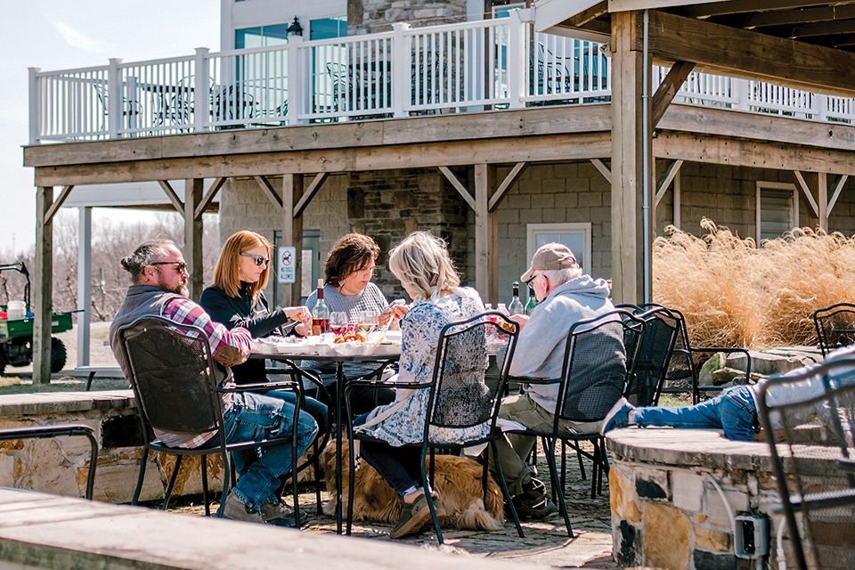 Visitors around an outdoor table at Quarry Hill Winery in Berlin Heights (photo courtesy of Quarry Hill Winery)