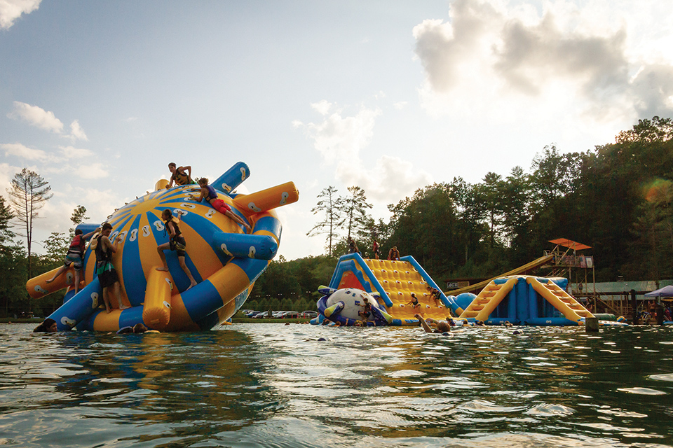 Inflatable toys and slides in water at Ace Adventure Resort in Oak Hill (photo courtesy of West Virginia Department of Tourism)