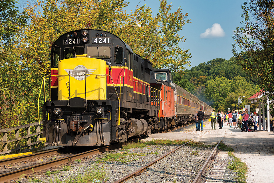 Akron’s Cuyahoga Valley Scenic Railroad train and passengers (photo by iStock)