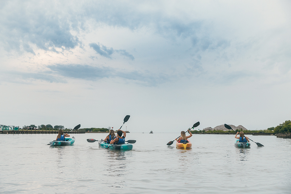 People kayaking on the Huron River with the help of Lake Erie Adventure Co. (photo courtesy of Lake Erie Adventure Co.)