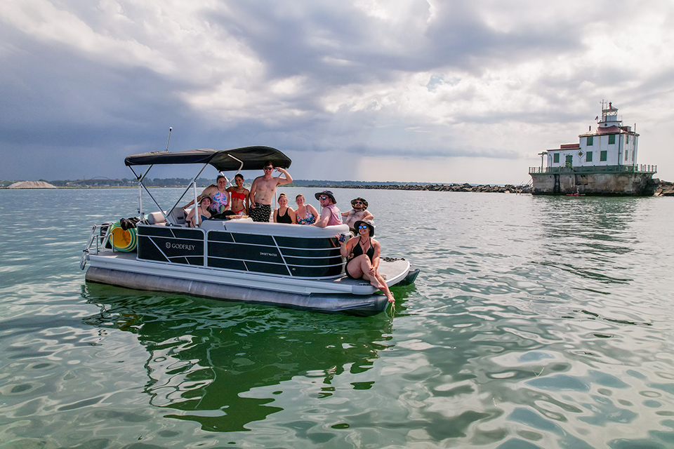 Group of people on a pontoon boat in Ashtabula Harbor (photo courtesy of Harbor Yak)