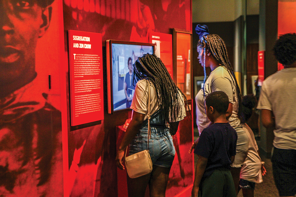 People exploring an exhibit at Louisville’s Kentucky Derby Museum (photo courtesy of Kentucky Derby Museum)