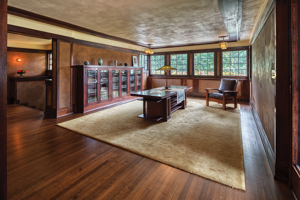 Reception room with display case, coffee table and chair in Springfield’s Frank Lloyd Wright-designed Westcott House (photo by Andrew Pielage)