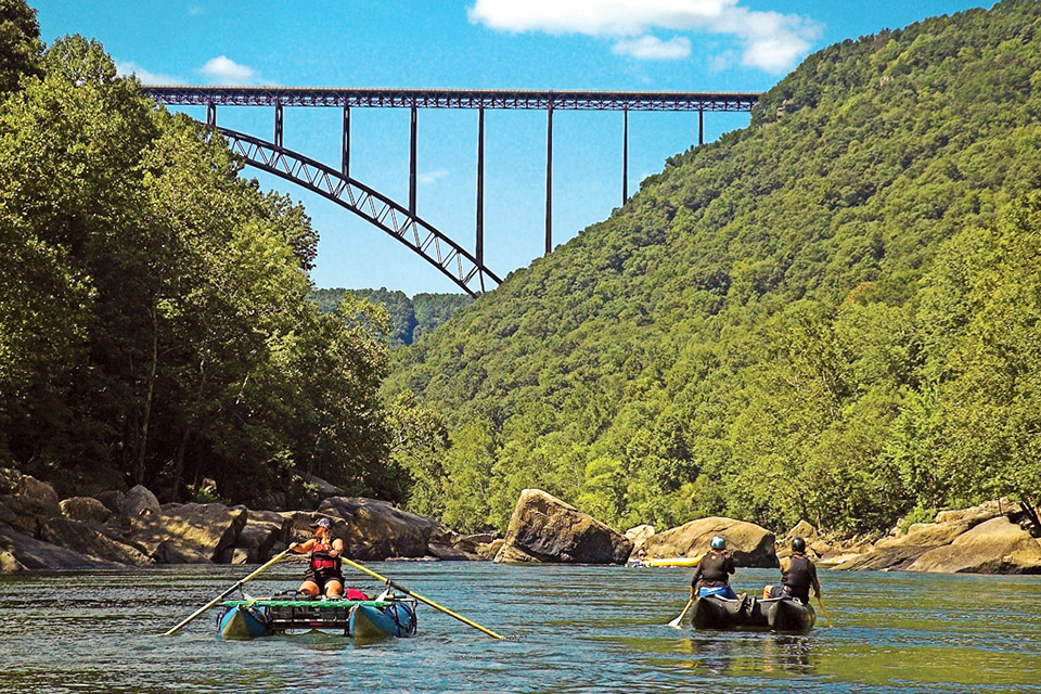 People rafting near New River Gorge bridge in West Virginia (photo courtesy of National Park Service)