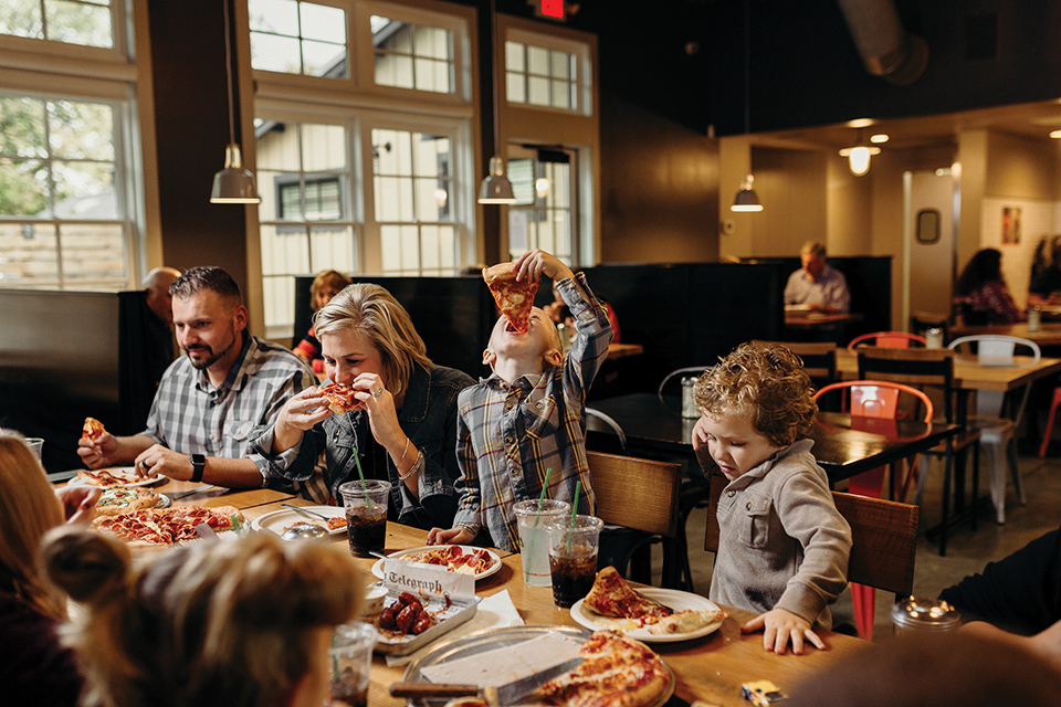 Family eating at Sugarcreek’s Park Street Pizza (photo by Agape Photography)