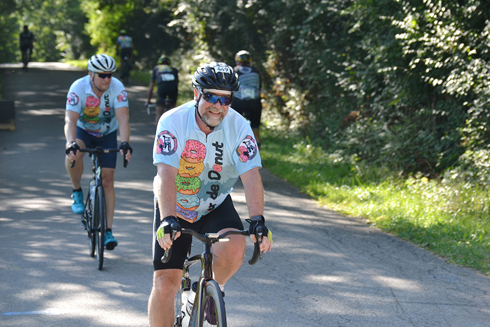 Men biking at Troy’s Tour de Donut (photo courtesy of Tour de Donut)
