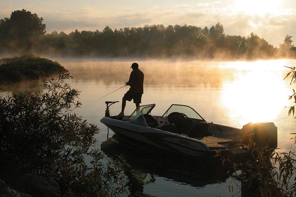 Man fishing on Grand Lake St. Marys in the early morning (photo courtesy of Grand Lake Region Visitors Center)