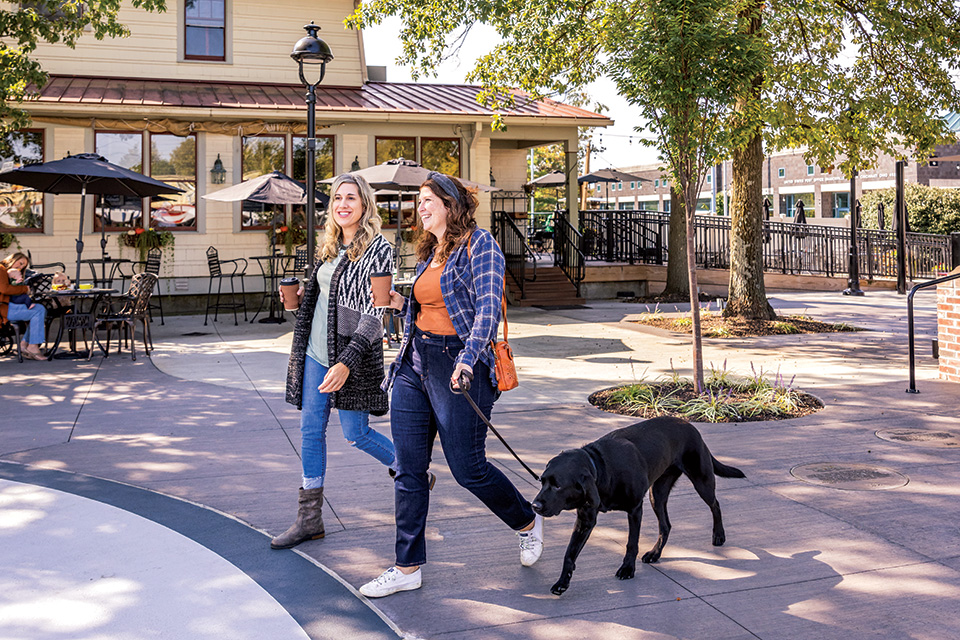 Women walking dog in downtown Sharonville (photo by Matthew Allen)