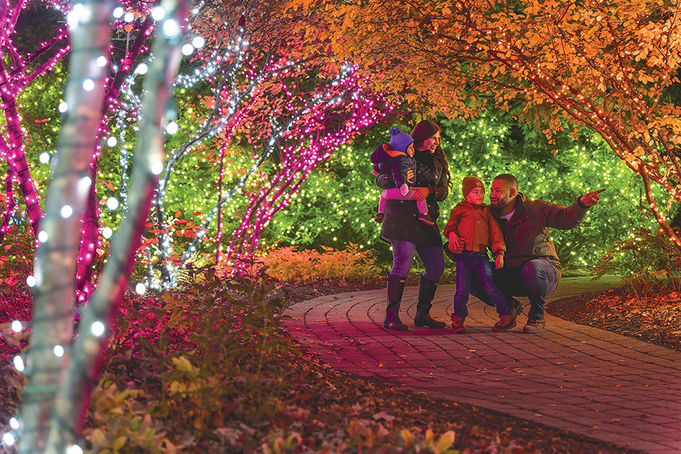 Family looking at Christmas lights at the Toledo Zoo’s Lights Before Christmas (photo by Katelyn Wessling / Toledo Zoo & Aquarium)