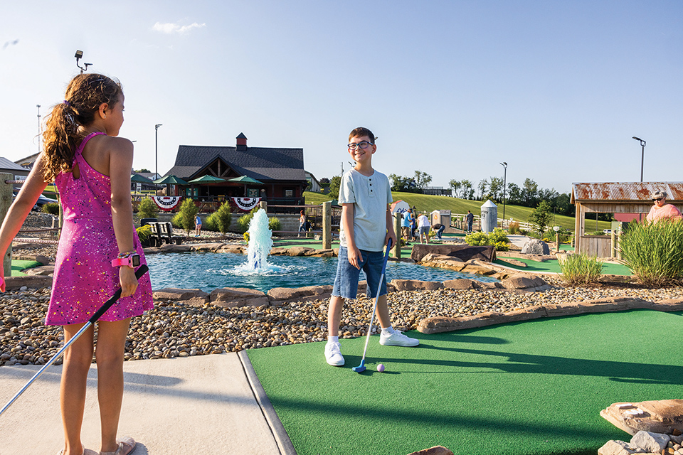 Kids playing putt putt at Country Acres Mini Golf in Millersburg (photo by Laura Watilo Blake)