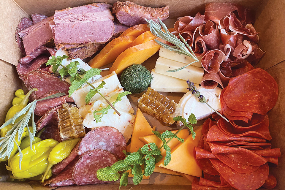 Charcuterie box of cured meats, greens, cheese and peppers at Toledo’s Fowl & Fodder (photo courtesy of Fowl & Fodder)