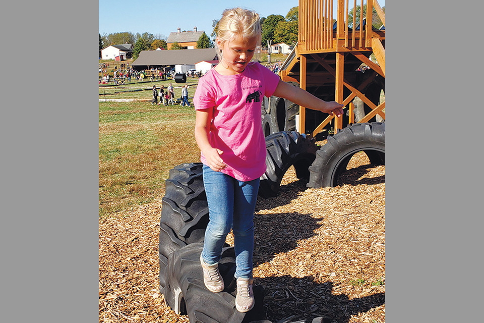 A girl plays at Pigeon Roost Farm in Hebron (photo courtesy of Pigeon Roost Farm)