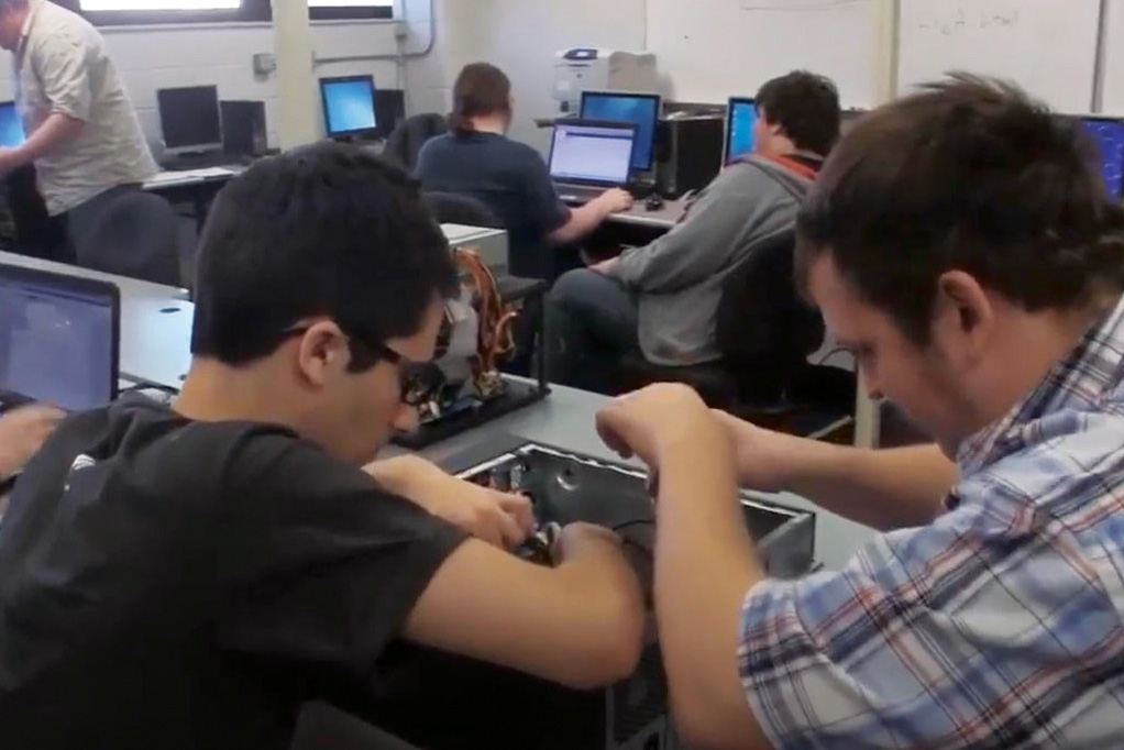 Students working on computer console (photo courtesy of Hocking College)