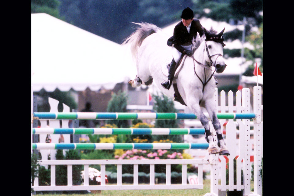 Rider Margie Goldstein and horse Daydeam jumping over rails at the 1992 Cleveland Grand Prix (photo courtesy of “The Cleveland Grand Prix: A Show Jumping First” by Betty Weibel)