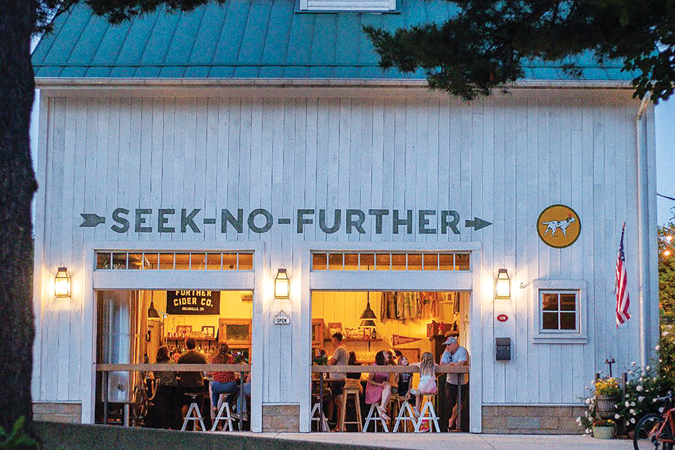 Exterior of Granville’s Seek-No-Futher Cidery at dusk (photo courtesy of Seek-No-Futher Cidery)