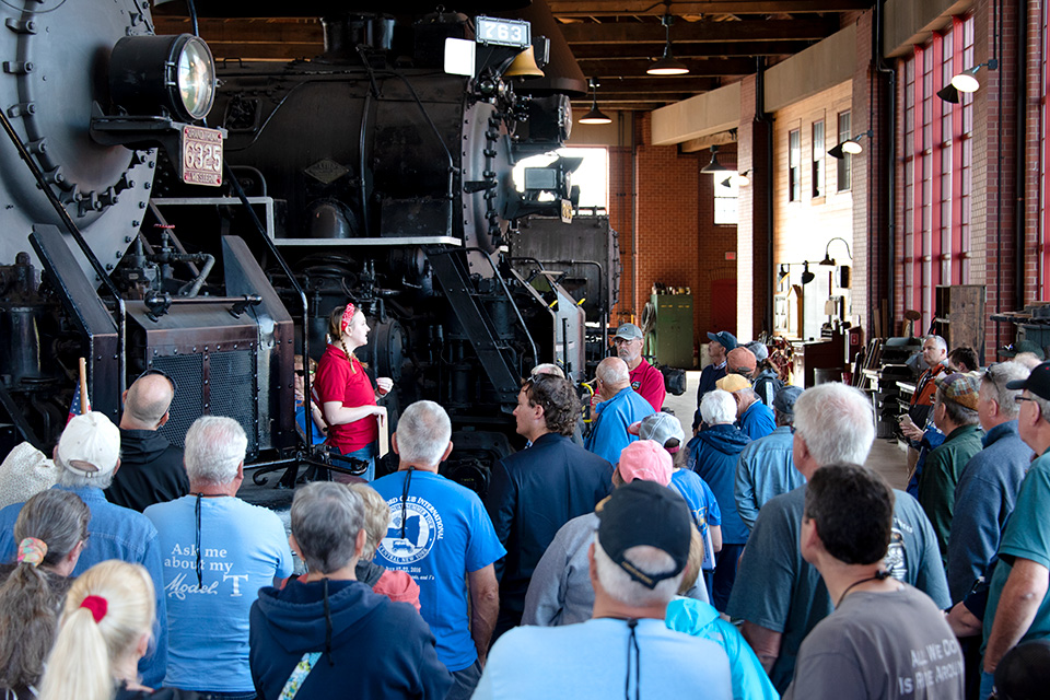 Crowd listening to tour guide at the Age of Steam Roundhouse Museum in Sugarcreek (photo courtesy of Age of Steam Roundhouse Museum)