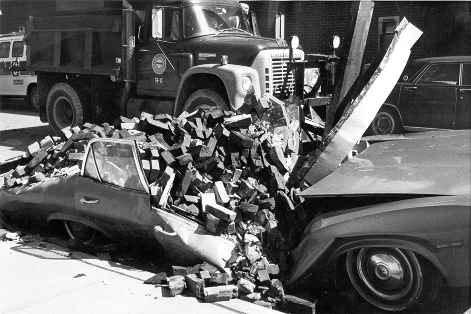 Car buried under pile of bricks at corner of Greene and Main streets after the 1974 Xenia tornado (photo courtesy of Greene County Public Library)