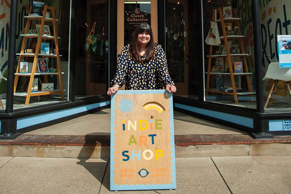 Sarah Arnold, owner of Clutch Collective in Marietta, standing outside her storefront (photo by Michelle Waters)